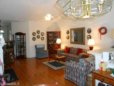 Living Room. Spacious Living Room with Gas log fireplace with open kitchen and dining area.