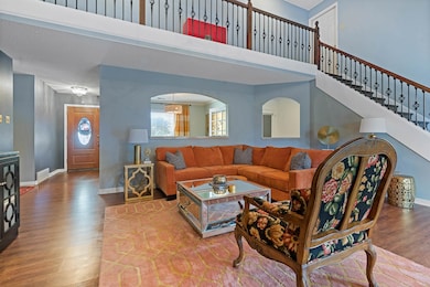 Living room with wood-type flooring