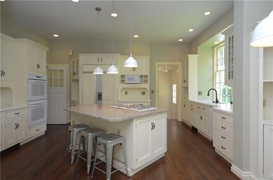 Gathering kitchen with large center island, gas st