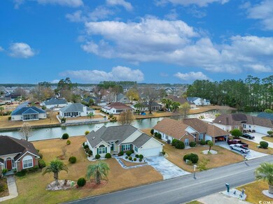 Bird's eye view with a water view and a residentia