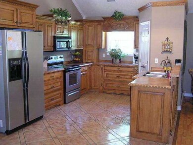 This custom kitchen incl. tons of storage, a pantr
