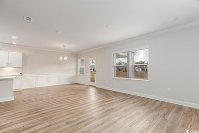 Unfurnished living room with an inviting chandelie