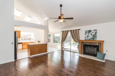 Family room with gas starter fire place open to ki