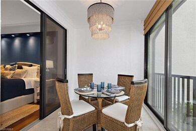 Dining room with a chandelier and ornamental moldi