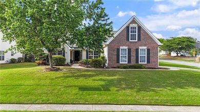 View of front of property with brick siding and a 