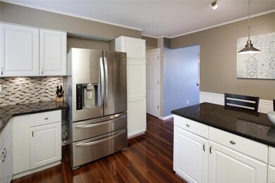 Granite countertops and pendant lights add sophist