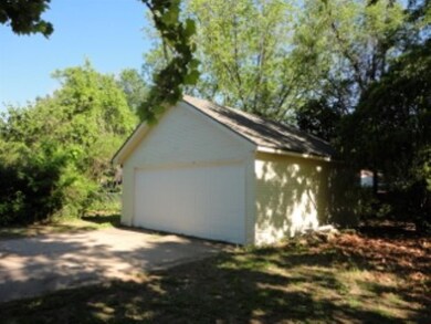 Detached 2 car garage with opener, one big door.