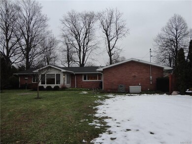 Rear exterior. Enjoy the open flagstone patio and 