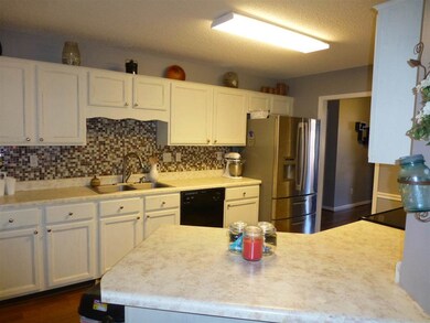 A view of the kitchen from the breakfast bar.