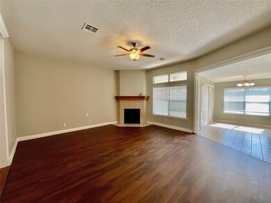 Unfurnished living room with ceiling fan with nota