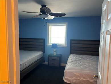 Bedroom with baseboards and a ceiling fan