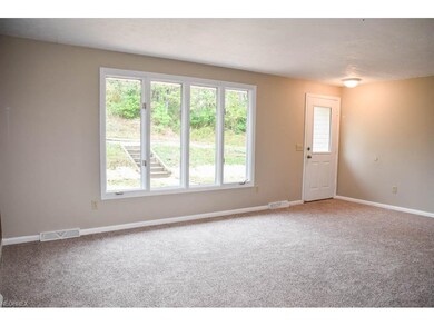 Sun-filled living room with new carpet.