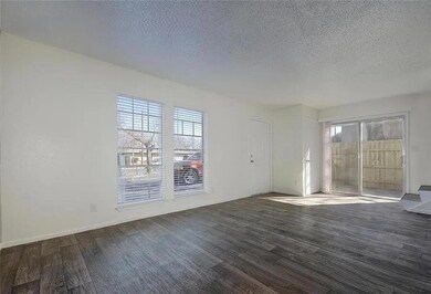 Unfurnished living room featuring dark wood finis