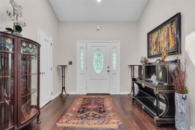 Entryway with hardwood / wood-style flooring and b