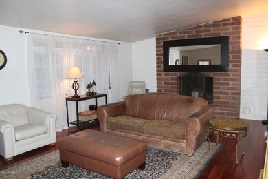 FAMILY ROOM WITH BRICK FIREPLACE