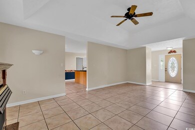 Unfurnished living room featuring ceiling fan, lig