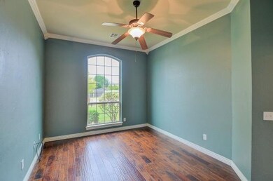 STUDY or 2nd BEDROOM:  Pretty arched window looks 