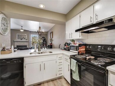 Kitchen with black appliances, under cabinet rang