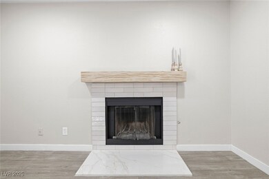 Detailed view of wood finished floors and a tiled