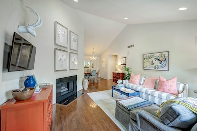 Living room is open to the dining room. Note the s