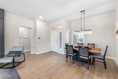 Dining room featuring baseboards, recessed lightin