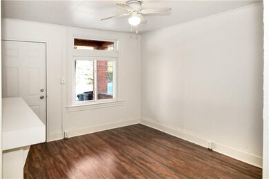 View of front door from living room