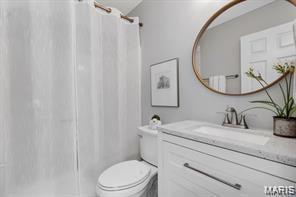 Full bathroom with vanity and a shower with shower curtain
