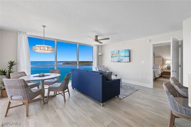 Living room featuring floor to ceiling windows, ce