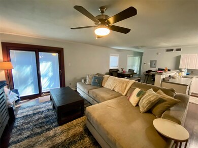 Living room looking at patio and backs up to dinin