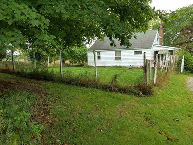 Fenced side yard for pets or garden.