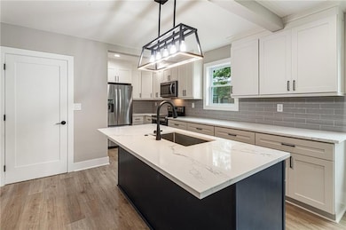 This photo is virtually staged to show the flow of the  open space of the living room, dining room, kitchen and sunroom.