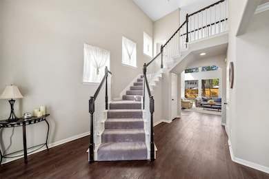 As you enter the home, notice the soaring ceilings, the light neutral paint and the gorgeous LVP flooring throughout the home.
