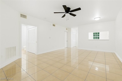 Unfurnished room with light tile patterned floors