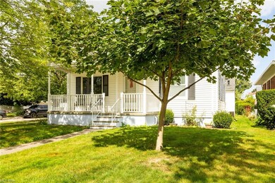 View of front of home with a porch and a front yar