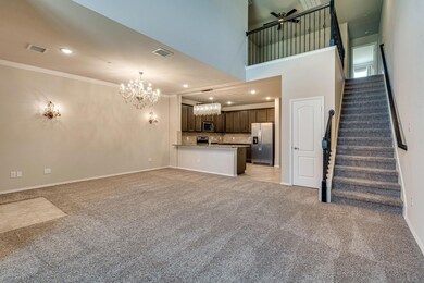 Unfurnished living room with crown molding, stairway, light carpet, visible vents, and an inviting chandelier