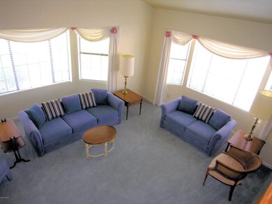 Living room has 2 bay windows