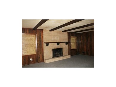 Gas Fireplace, beamed ceilings, & real wood covers