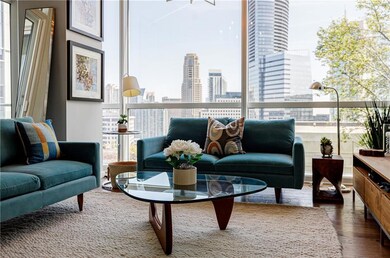 Living room with a view of city and dark wood-styl