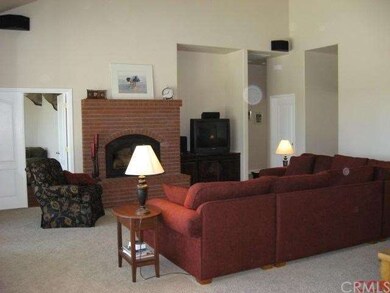 Wood burning fireplace in living room. The door on