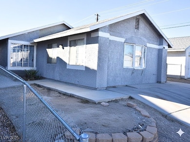 View of side of property featuring stucco siding