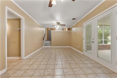 Unfurnished room with ceiling fan, french doors, ornamental molding, stairway, and light tile patterned flooring