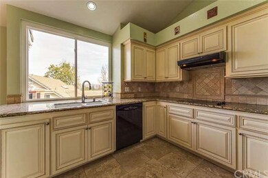 Granite counters and custom cabinetry grace the op