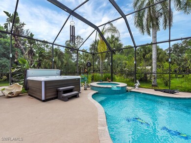 View of pool and a hot tub