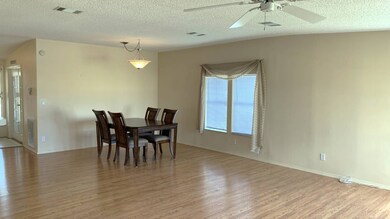 LARGE OPEN LIVING ROOM AND DINING AREA