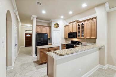 The kitchen is spacious and offers a completely fu