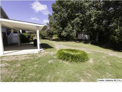 Covered patio allows for relaxing anytime of the d