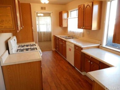 Clean Galley Styled Kitchen with LVT Flooring