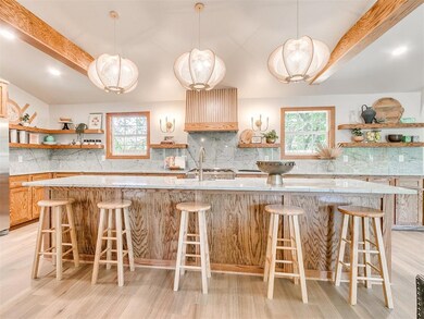 Kitchen featuring sapphire quartz countertops & ba