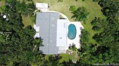 3/2 with pool, grove and 2 car garage