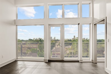 floor-to-ceiling and wall-to-wall windows fill the home with natural light, a Tremont Tower signature!